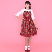 A cute red dress with a pattern of strawberries by Emily Temple cute