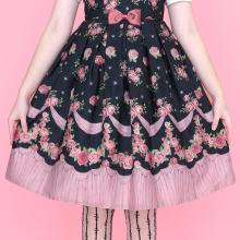 A cute black dress with a pattern of roses and pink banners by Emily Temple cute